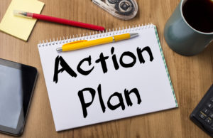 Action Plan - Note Pad With Text On Wooden Table - with office tools